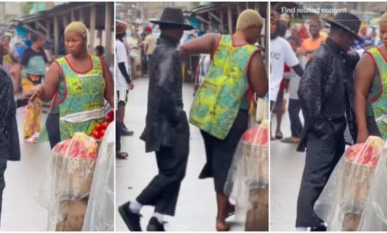 Man causes a stir as he dances like Michael Jackson beside lady in market, she pushes him away (Video)