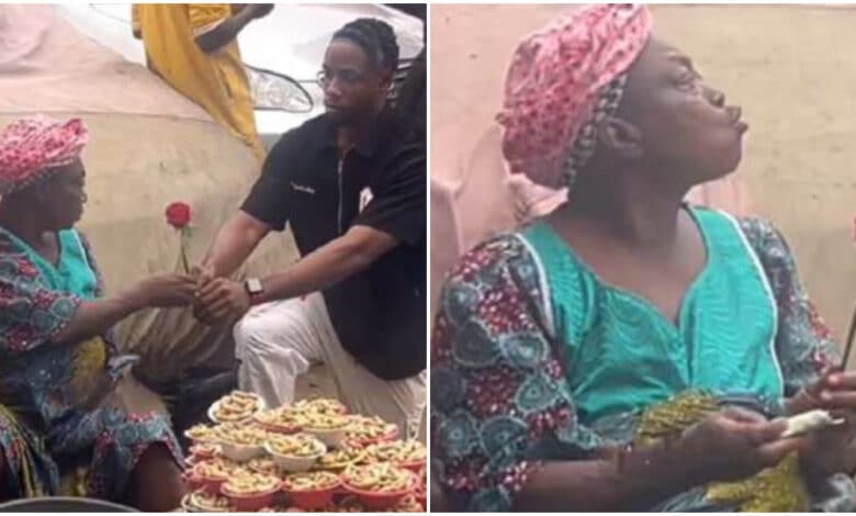 Old woman selling groundnut receives rose flower, blows kiss to young man who gave it to her
