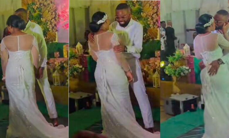 Groom bride's father kiss