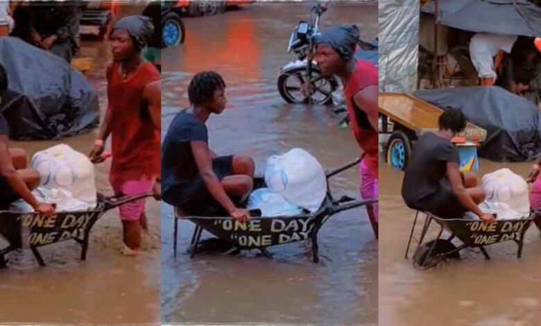 Man wheel barrow flooded