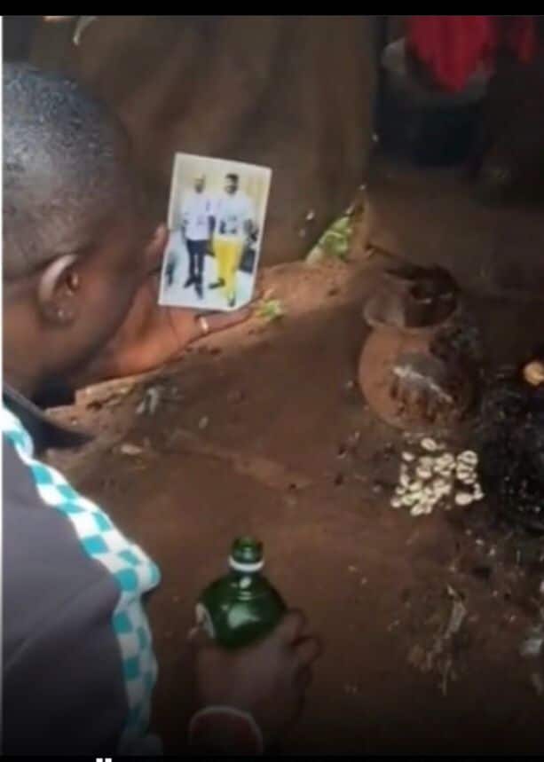 Mohbad's fan takes Naira Marley and Sam Larry's photo to shrine 