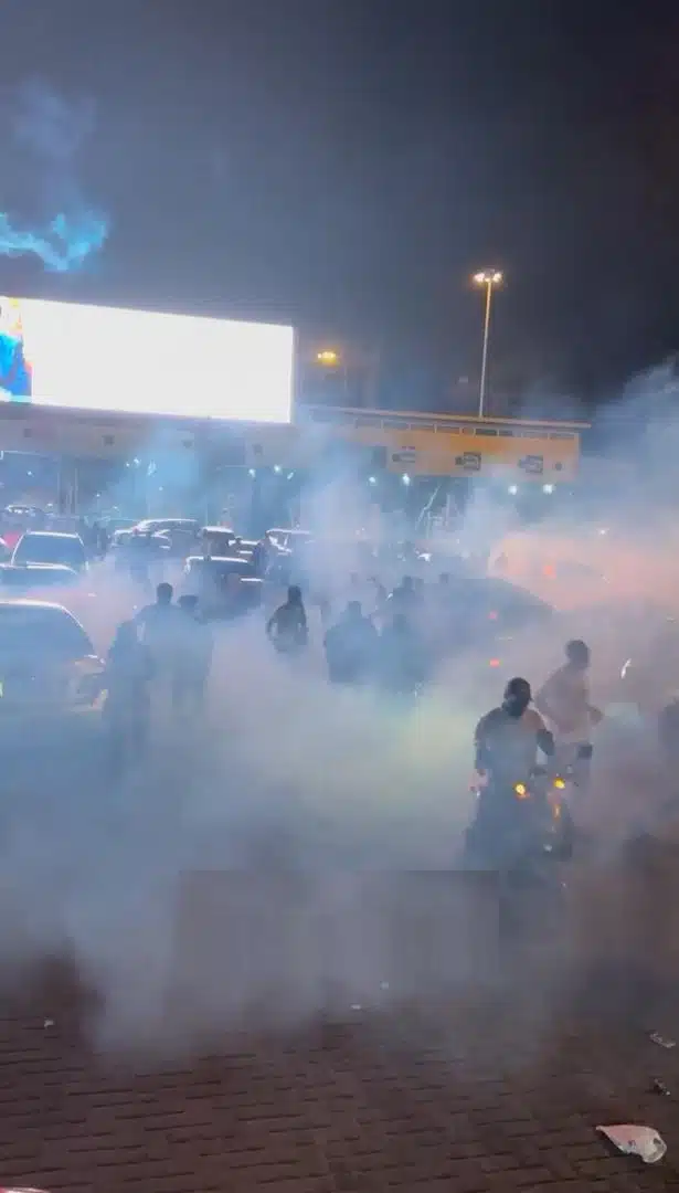 Mohbad: Moment Police disperse youths with teargas, protester injured at Lekki toll gate (Video)