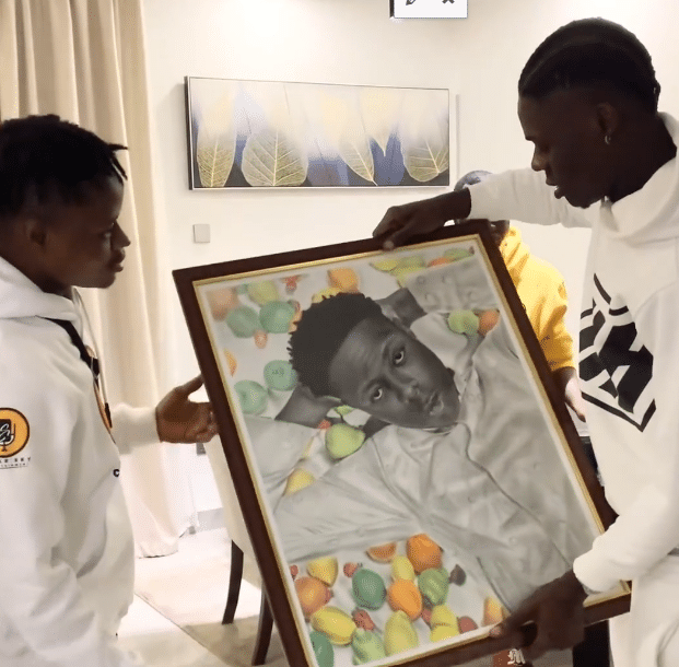 Mohbad: Throwback video of the singer beaming with joy as fan draws his portrait, presents it after framing