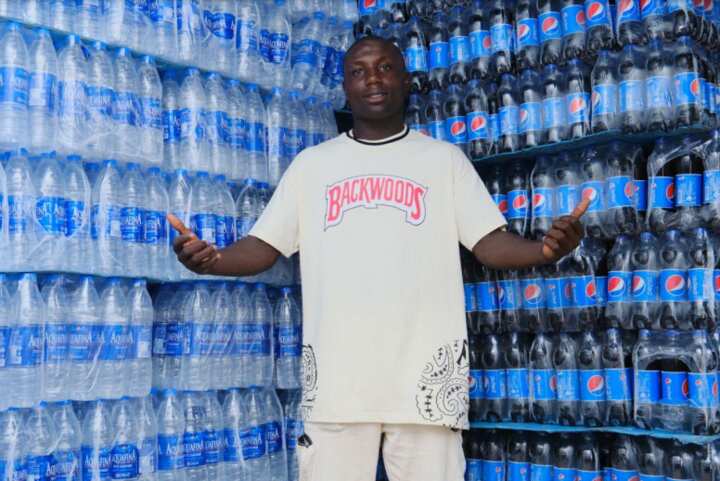 Aquafina empowers viral hawker, Dr. H2O, rewards him with full business setup worth millions of naira