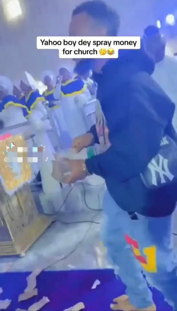 “It shows how corrupt the church has become” — Netizens react as young man make it rain money in a white garment church 