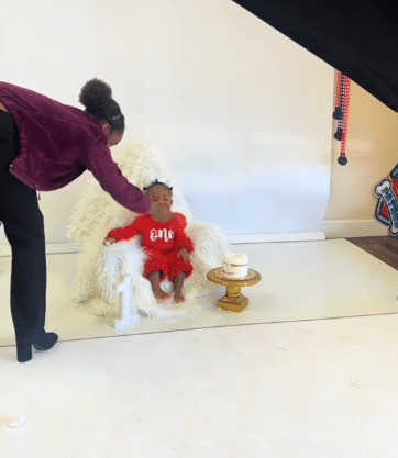 Woman causes buzz as she poses like chair during birthday photoshoot to keep her child calm