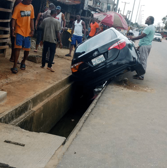 Moment car wash attendant narrowly escapes death after crashing customer's vehicle while test driving it in Port Harcourt