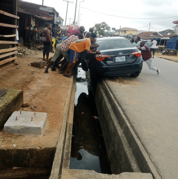 Moment car wash attendant narrowly escapes death after crashing customer's vehicle while test driving it in Port Harcourt