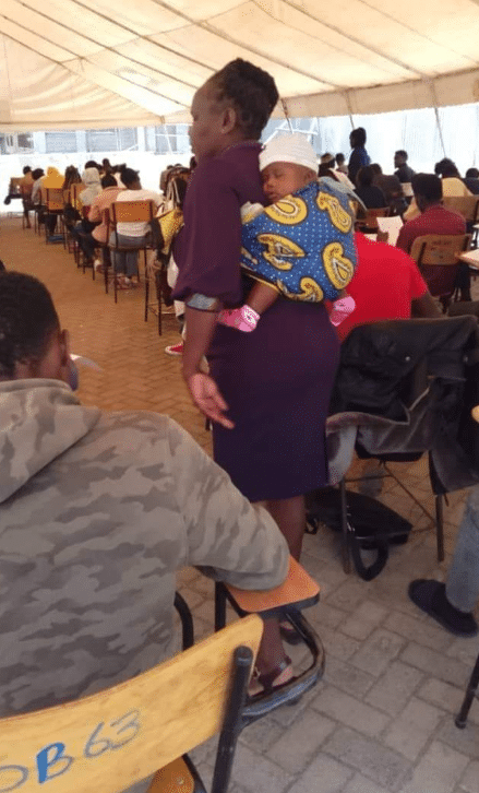 Lecturer melts hearts as she carries student’s baby, allows mother to focus on her exam paper