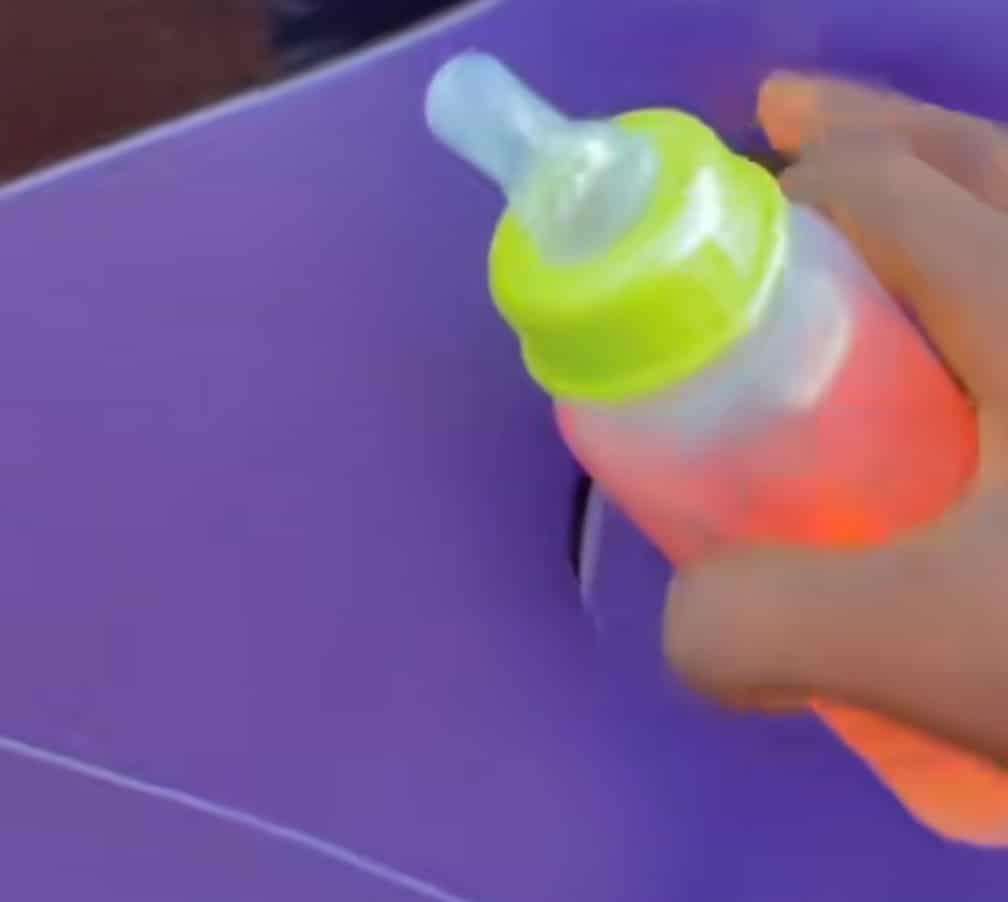 Man car feeding bottle