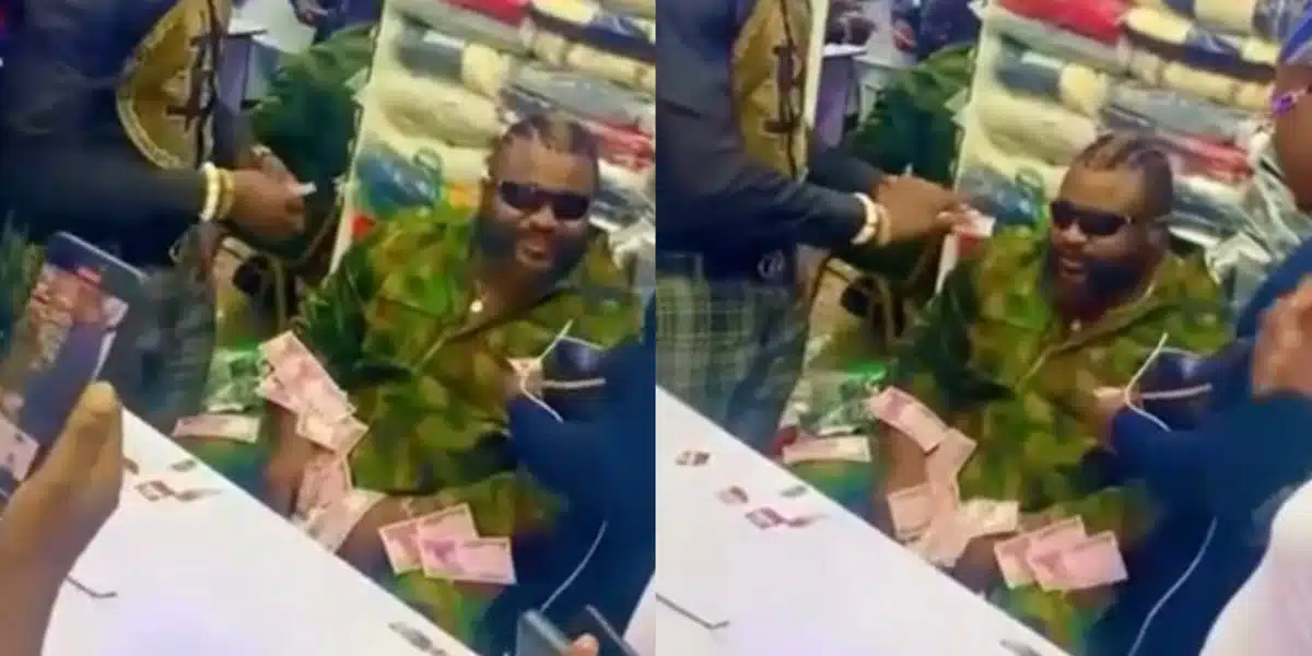 Kizz Daniel’s Bouncer all smiles as his fans make it rain cash, sprays him money