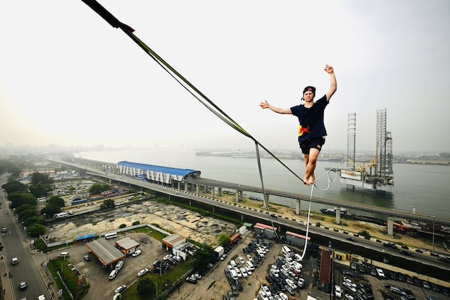 Guinness Record holder, Jaan Roose walks on rope across Lagos Bridge