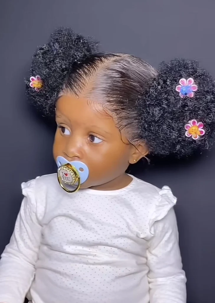 “Let babies be babies” — Netizens react angrily as mother installs frontal wig for her daughter for first birthday