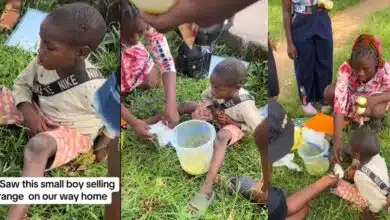 "People are suffering" - Little boy with fever sleeps on road while selling oranges, ladies sit with him, and sell on his behalf