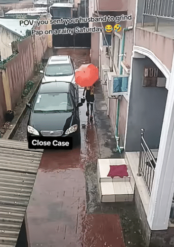 Lady stuns many as she sends her husband to grind pap in heavy rain