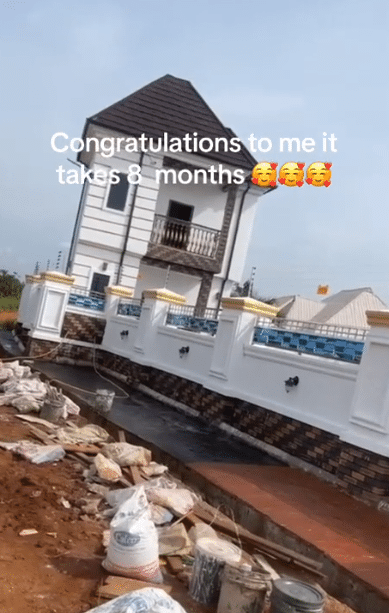 "God did it in 8 months" - 20-year-old man overjoyed, lies on floor as he builds mansion at age 20 in Anambra