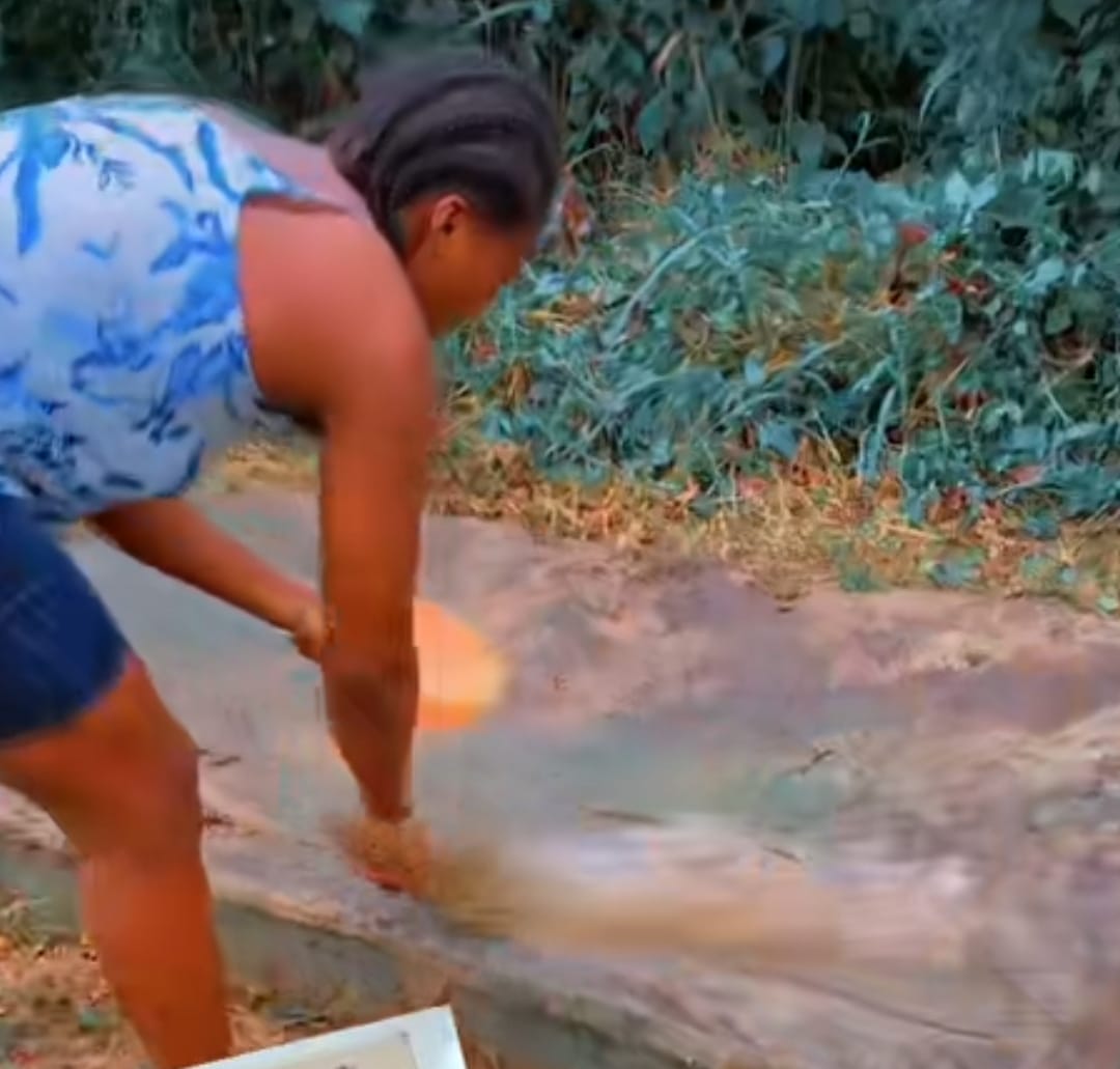 Lady late mother's grave broom wash dirts  