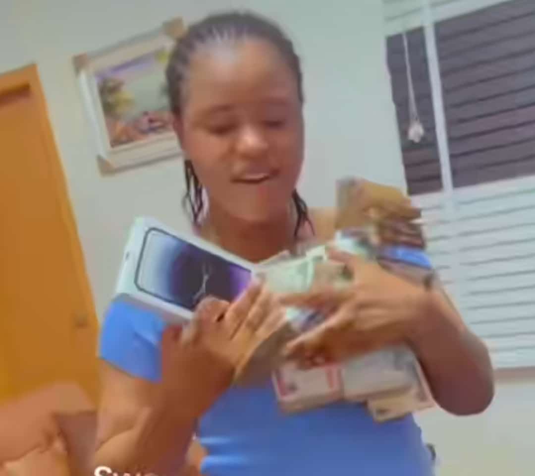 wife knees husband iPhone 15 Pro Max cash bags birthday