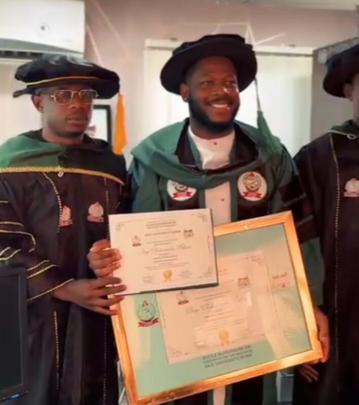 Frodd celebrates after receiving honorary doctorate