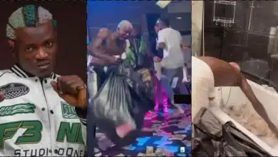 Portable flaunts pile of money sprayed on him at a club in Russia