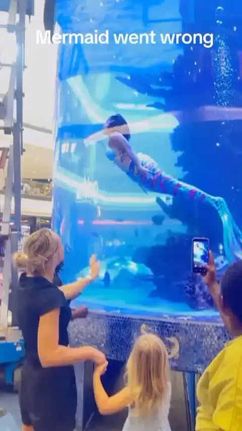 Moment mermaid almost drowns in an aquarium tank