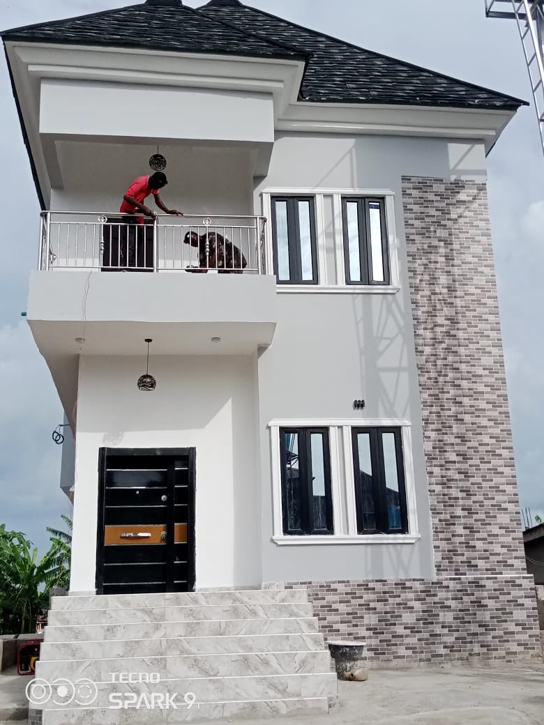 Man celebrates as he builds luxury house for his parents