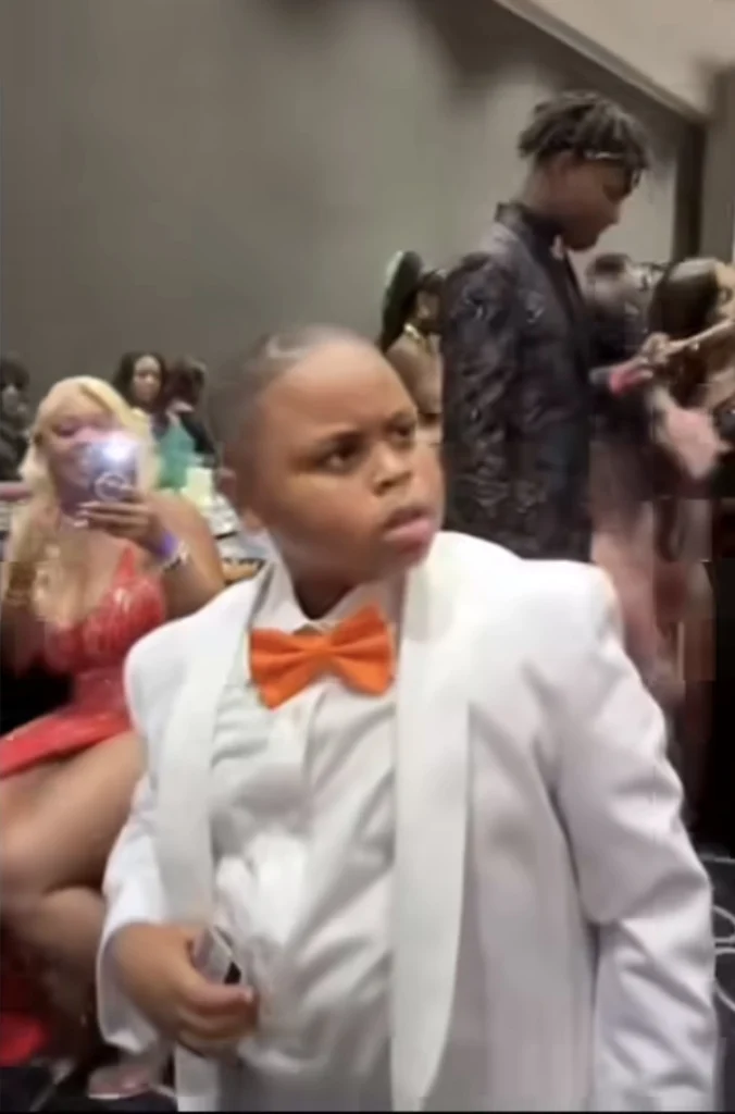 Boy sheds hot tears as he pushes off photographer who his mother was twerking on 