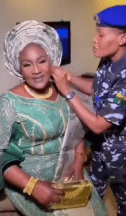 Video of policewoman helping Osun First Lady, Titilayo Adeleke, wear her earring causes buzz online