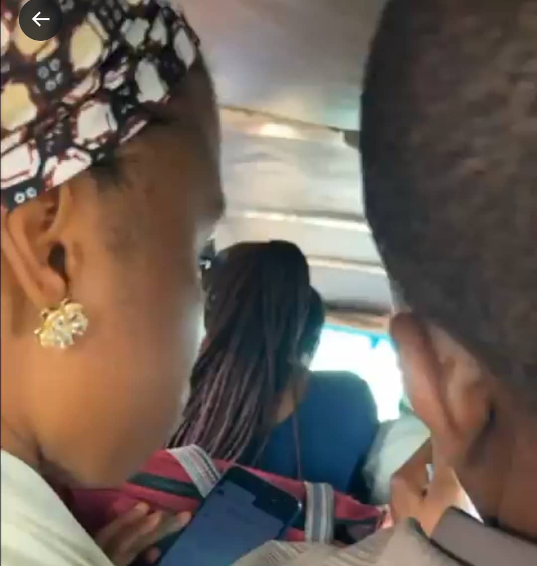 "Couple goals" - Nigerian husband, wife generate buzz as they play SportyBet together on their phones inside a bus