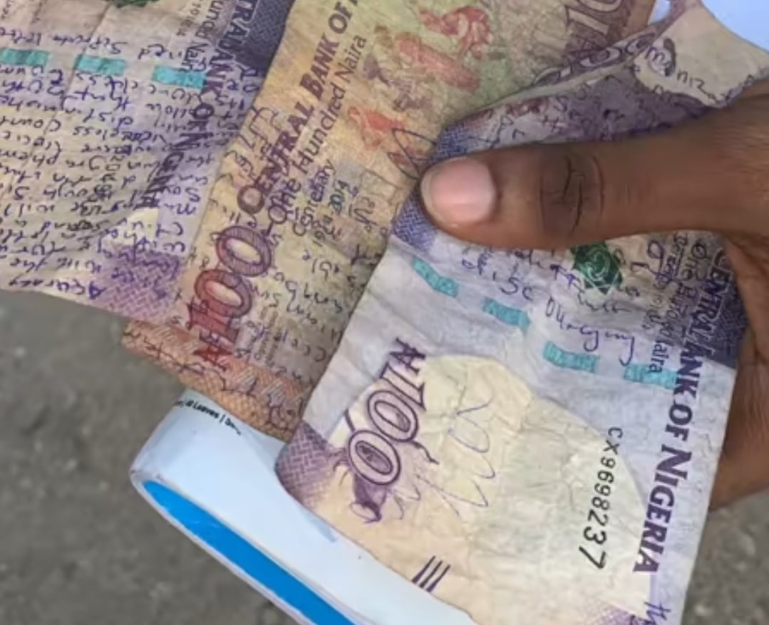 "They call me shalipCOPY" - Student afraid of carry-over inscribes details on arm, ₦100 naira notes to cheat in exams