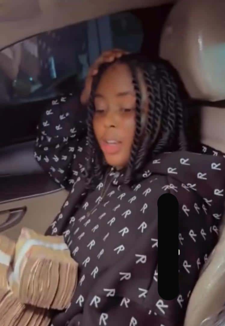 Lady flaunts stash of money spent at club with her Benin boyfriend