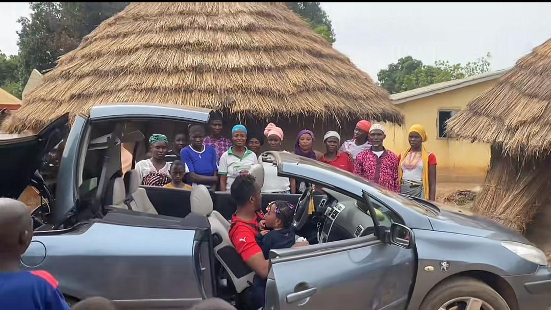 Man oppresses villagers as he arrives home for Christmas in convertible car