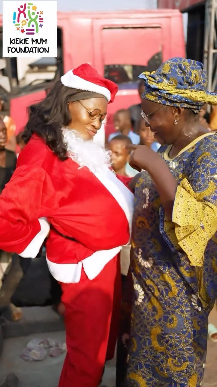 Kie Kie dresses like Father Christmas as she storms Lagos street to celebrate love with kids and mothers
