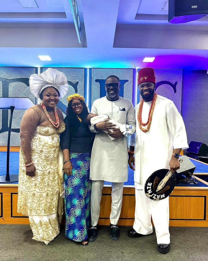 Stan Nze and wife Blessing Obasi at their son's dedication