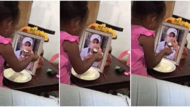 "This is too painful" - Moment grieving little girl feeds her late father's portrait at home