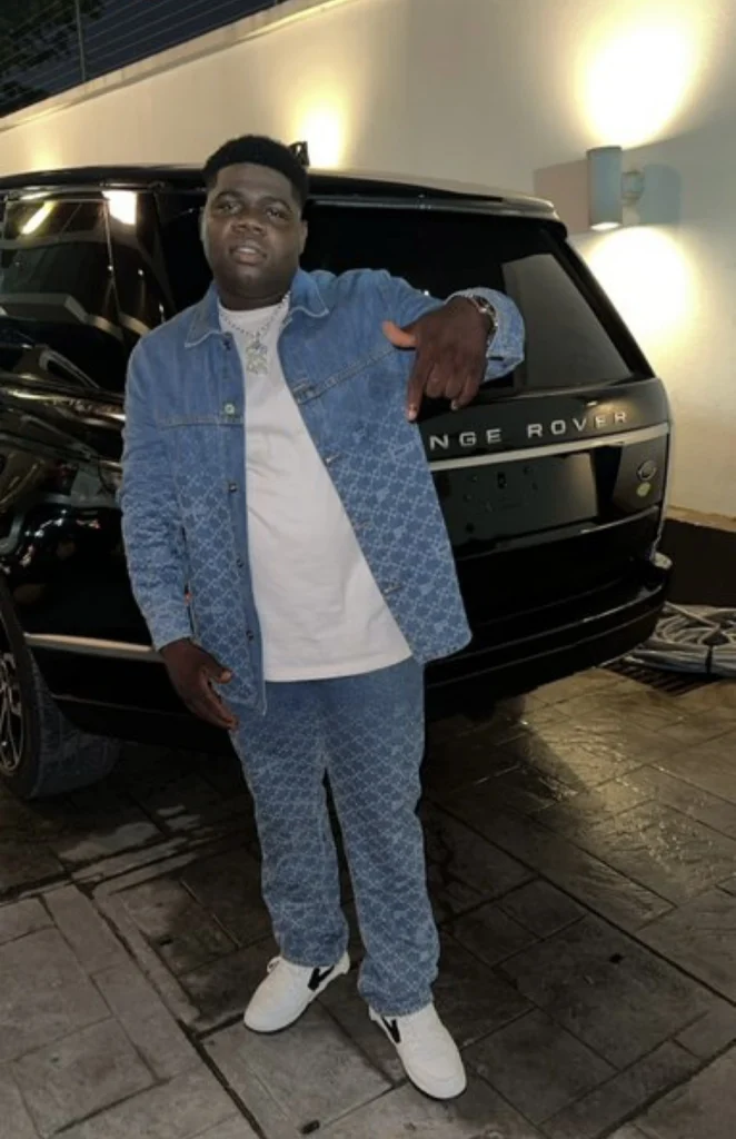 “How much Burna dey pay am sef” — Burna Boy’s driver set tongues wagging over expensive outfit 
