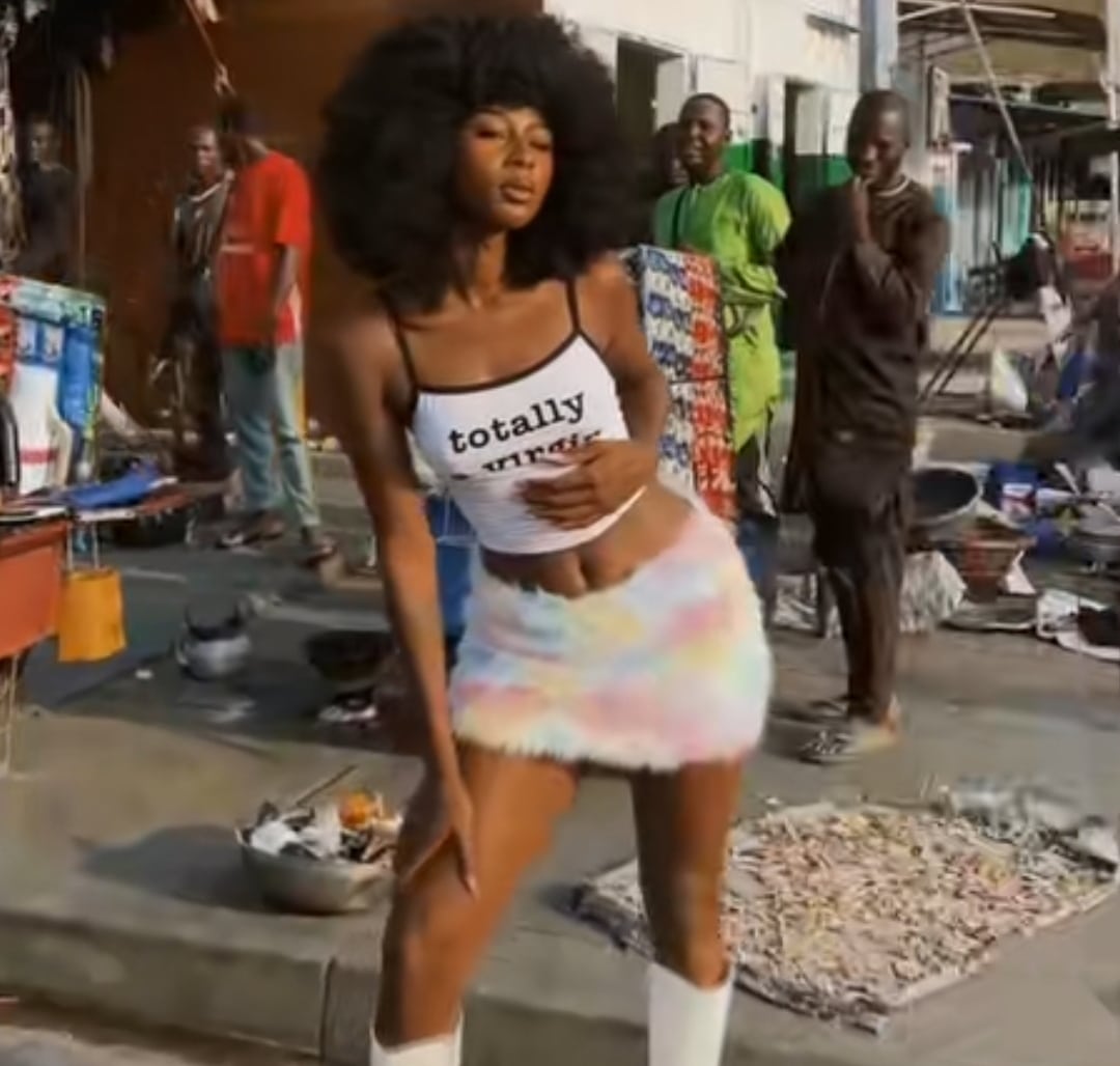 "Benin people can look eh" - Awkward stares at beautiful lady during photoshoot in Benin Republic causes stair online