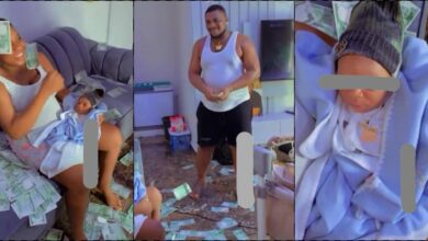 Happy father sprays wife and newborn baby with money