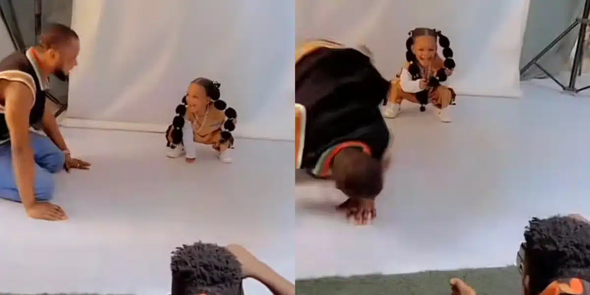 Father melts heart as he does stunts to make daughter smile during photoshoot