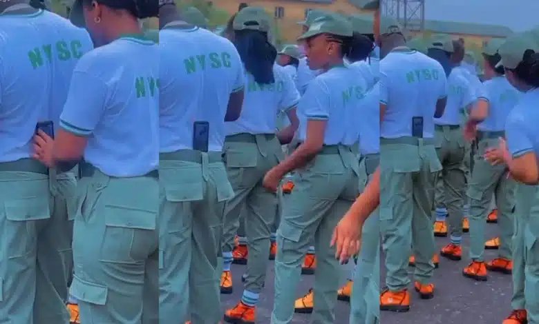 “Una don turn grown man to ring light” — Reactions as female NYSC corpers use man as a tripod stand for video