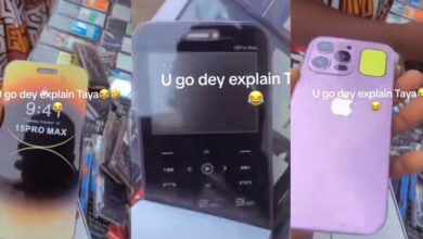 "At least, you can take chop village girls" - Social media buzz as man exposes fake iPhone 15 Pro Max at local market