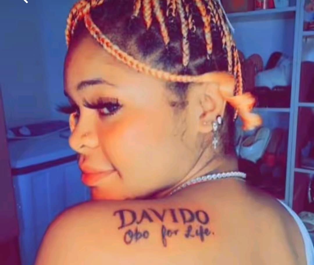 "Davido, you're my best, I love you" - Beautiful lady boldly declares love for Davido as she tattoos his name on her back
