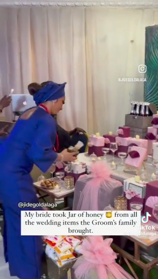 Bride chooses a jar of honey from Groom Family's presentation