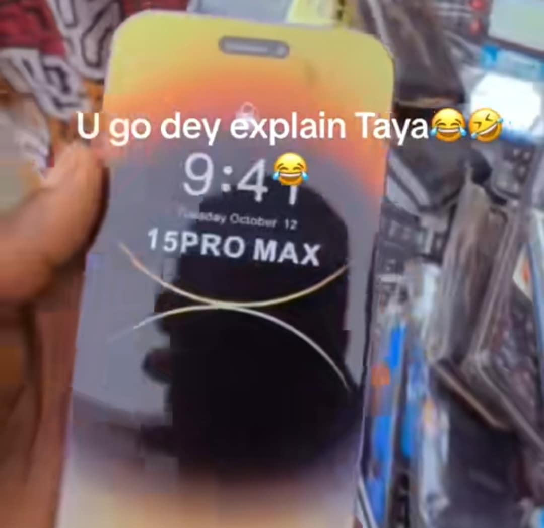 "At least, you can take chop village girls" - Social media buzz as man exposes fake iPhone 15 Pro Max at local market