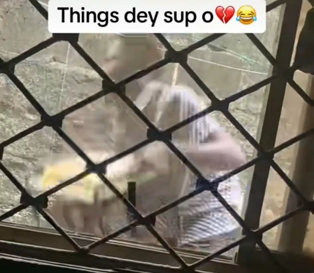 "E don red" - Young Nigerian jumps fences to steal generator, caught on camera