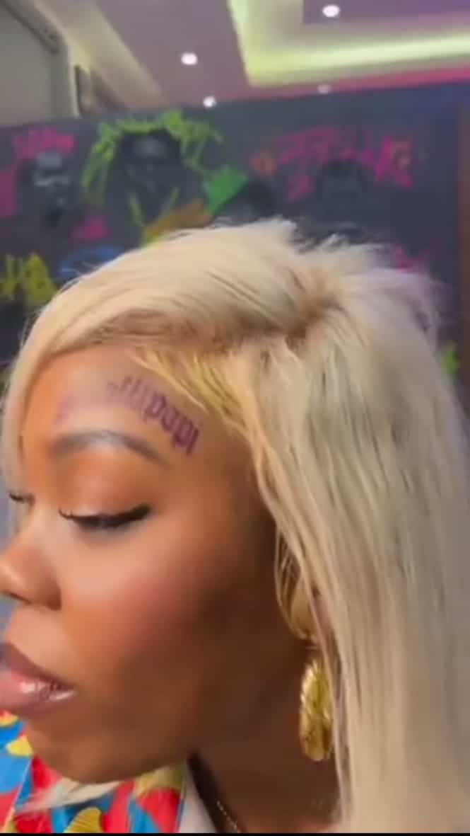 Nigerian Lady tattoos Shallipopi's name on her forhead