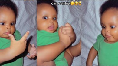 Adorable moment baby discovers she is born with hands and legs