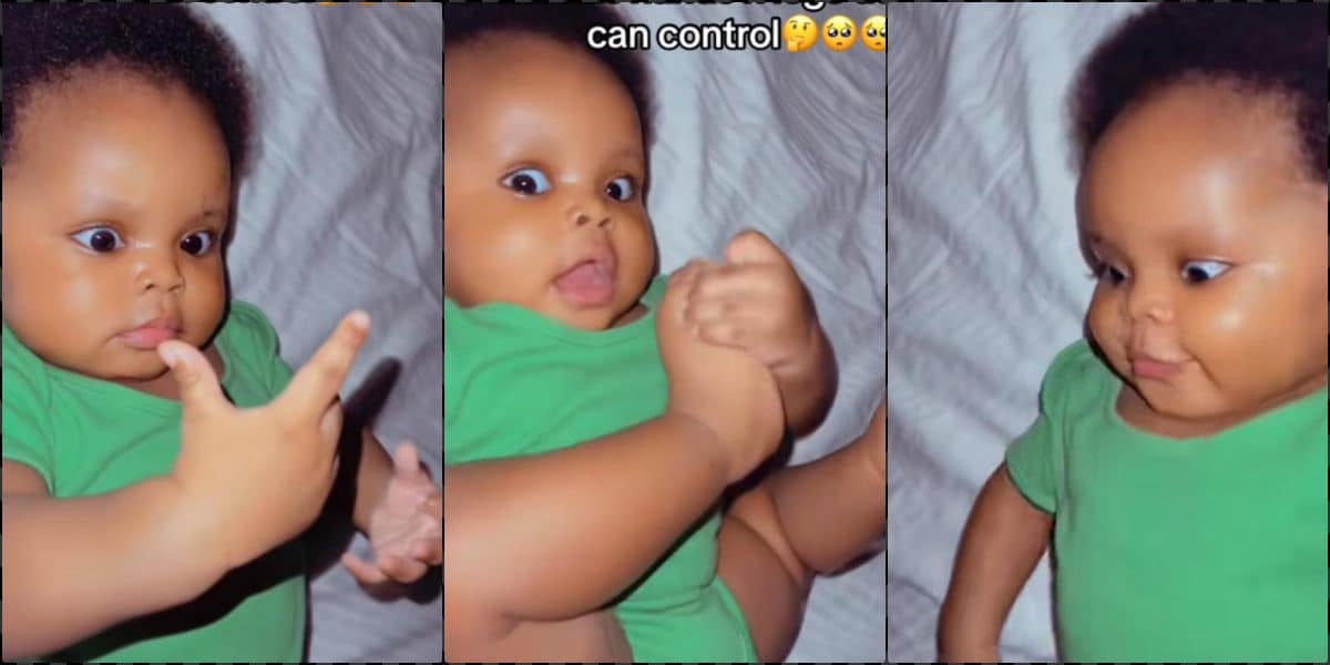 Adorable moment baby discovers she is born with hands and legs