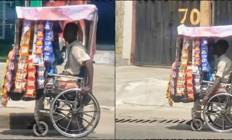 Physically challenged man selling goods from wheelchair