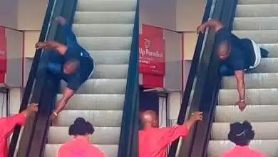 “No be head of the family dey ground so” — Reactions as man gets stuck on escalator